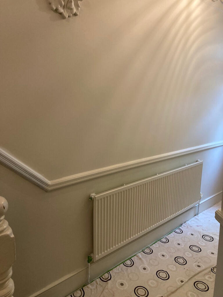 Landing walls freshly painted Farrow and Ball School House White after interior preparation, showing a clean finish